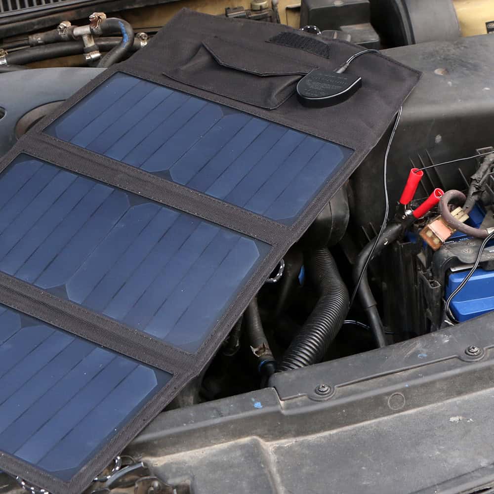 Flexible solar panel kit installed on a car engine bay for vehicle power, emergency use, and off-grid energy solutions. Ideal for outdoor travel, RVs, and solar vehicle systems.