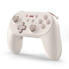 Wireless gaming controller in soft beige, compatible with multiple consoles for immersive play and enhanced gaming experience.