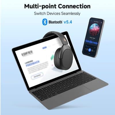 Wireless Bluetooth headphones and smartphone with music app on a laptop for seamless device connection, ideal for optometry and eyewear store displays.