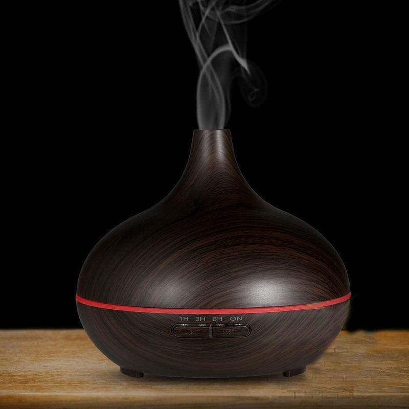 Essential oil diffuser with warm wood grain finish, remote control, and adjustable timing settings, enhances home ambiance and air quality. Ideal for relaxation and wellness routines.