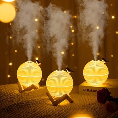 Smoke diffuser lamps with yellow glowing spheres and small birds, cozy ambient lighting, decorative vapor emitters for home wellness, ambient mood lighting from Monalisa Store.