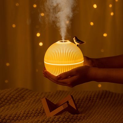 Relaxing aromatherapy diffuser with warm glow, steam mist, and wooden stand, ideal for creating a calming environment, essential oil therapy, and ngủsilent relaxation at Monalisa Store.