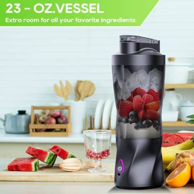 Blender with mixed berries and fruit, Monalisa Store, portable smoothie maker, compact kitchen appliance, fruit blender for smoothies and shakes, versatile kitchen gadget for healthy drinks, modern black portable blender, convenience blender for home and gym use, easy-to-clean fruit blender, stylish and functional kitchen device, premium quality portable blender, countertop blender for smoothies and juices, Monalisa Store kitchen accessories, innovative fruit blender design, high-performance portable blender.