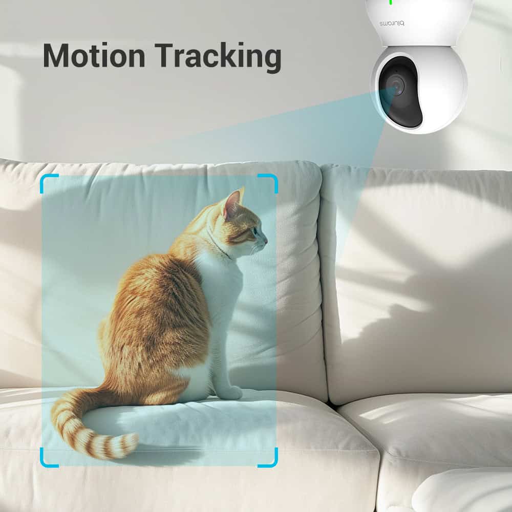 Motion tracking security camera monitoring a sitting cat on a white sofa, highlighting smart pet surveillance and home security from Monalisa Store.