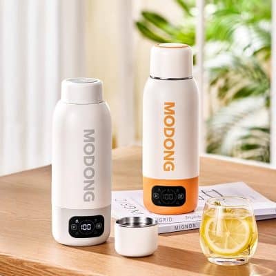 1. sleek white and orange Moding portable vacuum flasks with digital temperature display on a wooden table.