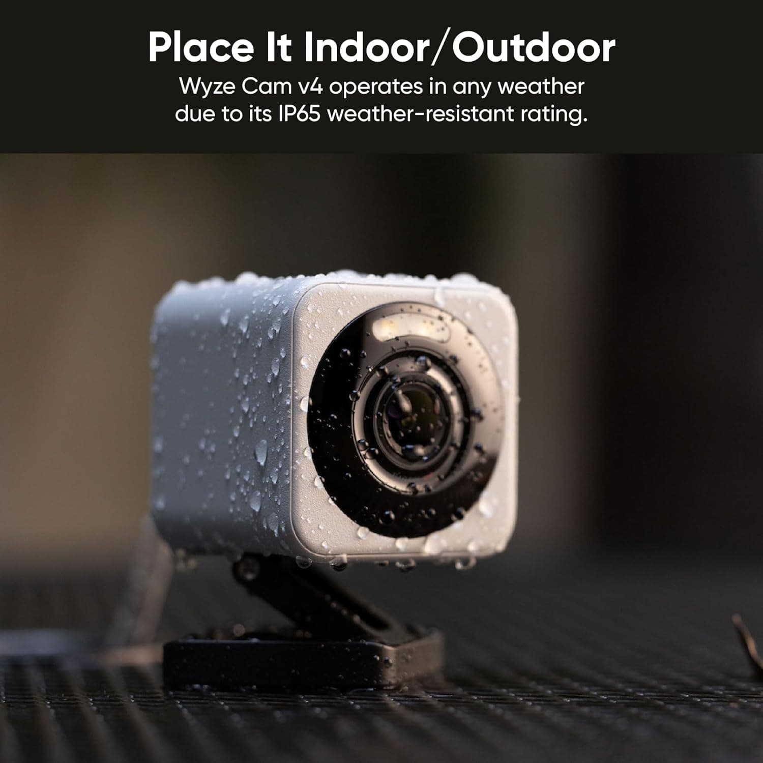 Waterproof security camera for indoor and outdoor use, IP65 weather-resistant rating, ideal for home surveillance, monitoring, and security, featuring Wize Cam v4 technology, rain droplets on lens.