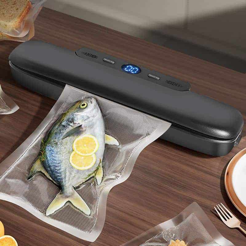 High-quality vacuum sealer machine for preserving fresh fish and seafood, featuring digital display and adjustable settings for optimal sealing.