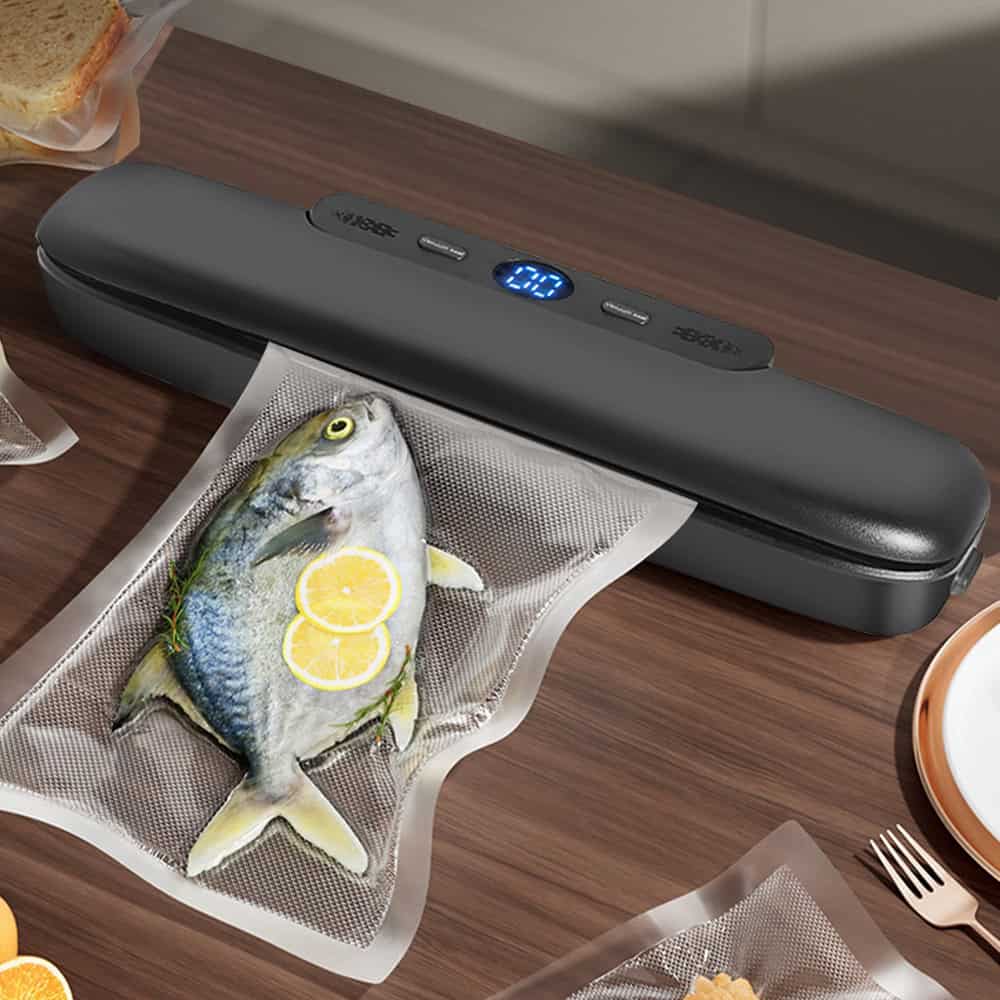 Compact vacuum sealer for food preservation and storage. Perfect for sealing fish, meats, and produce to extend freshness and prevent spoilage.