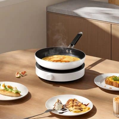 Silicone non-stick cooking pan with electric burner, ideal for making breakfast or snacks. Perfect for home kitchen, countertop, or restaurant use, featuring even heat distribution and easy cleaning.