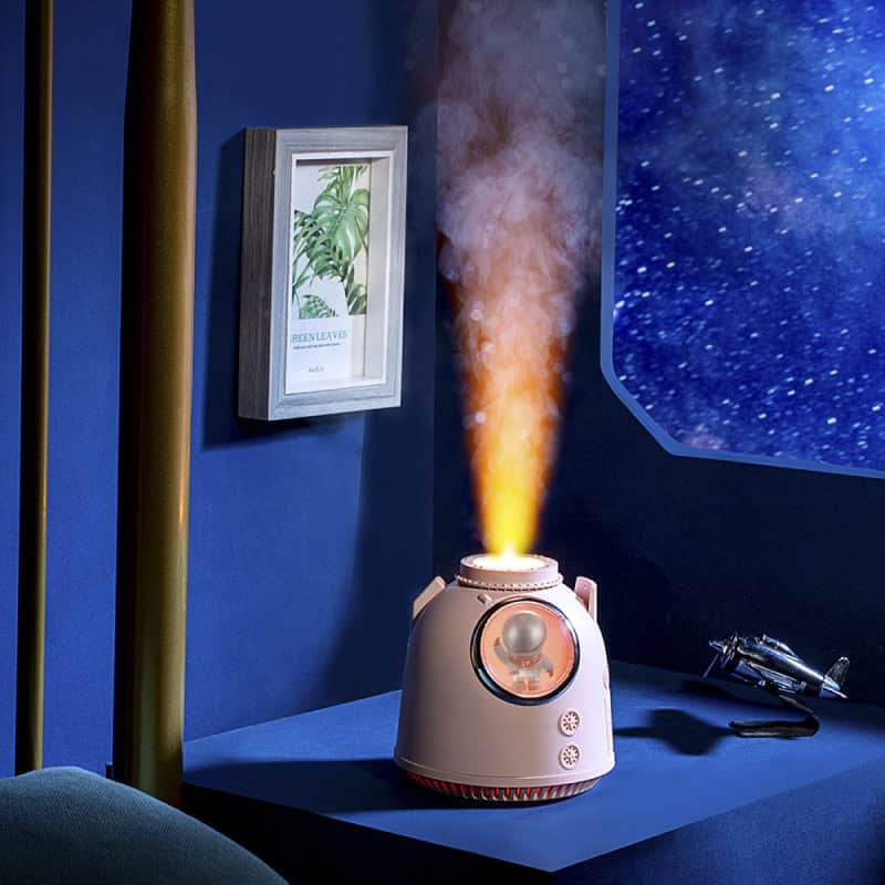 Humidifier emitting mist in a modern, stylish room with blue walls and starry window background, ideal for health and wellness, perfect for improving indoor air quality at home or in a spa setting.
