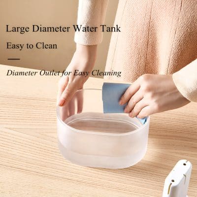 Large diameter water tank for easy cleaning with convenient outlet for hygiene and maintenance.