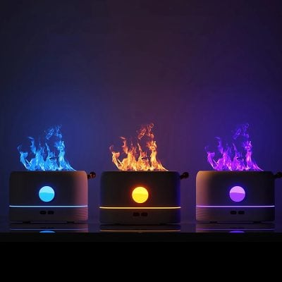 Blue, yellow, and purple color-changing LED aromatherapy diffusers with flame effect, enhancing relaxation and mood in modern wellness and spa settings.