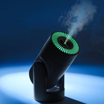 High-tech humidifier emitting steam with a modern black design, illuminated by a green circular LED light, perfect for smart home or medical environments.