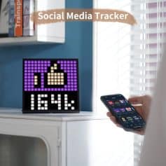 Thumbs-up social media icon pixel art display on digital clock, demonstrating social media tracking, digital device, branding, technology, social media marketing, and digital communication.