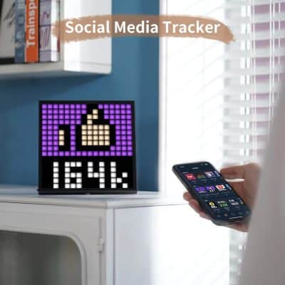 Thumbs-up social media icon pixel art display on digital clock, demonstrating social media tracking, digital device, branding, technology, social media marketing, and digital communication.