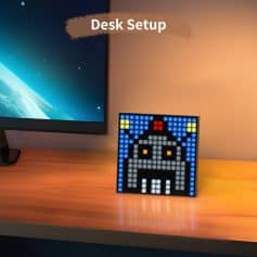 Monalisa store desk setup with a pixel art robot and computer screen, modern workspace, tech accessories, creative desk organization, digital workspace decor, opt.