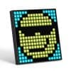 LED pixel art face sign, digital wall decoration with vibrant blue and yellow lights, ideal for modern optometry store interior design, creating an eye-catching ambiance.