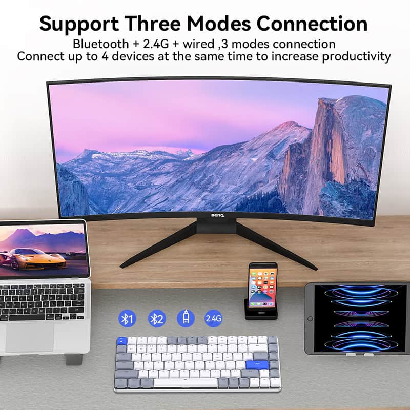High-resolution monitor displaying mountain scenery, connected via Bluetooth and wired modes on a sleek workspace at Monalisa Store.