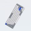 Compact wireless keyboard with white, gray, and blue keys, ideal for office and tech setups. Sleek, ergonomic design ensures comfortable typing experience for productivity.