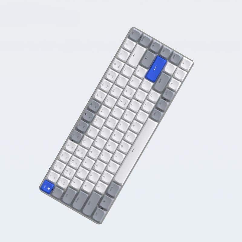 Compact wireless keyboard with white, gray, and blue keys, ideal for office and tech setups. Sleek, ergonomic design ensures comfortable typing experience for productivity.