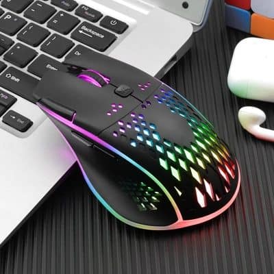 RGB gaming mouse with customizable lighting on a workspace.