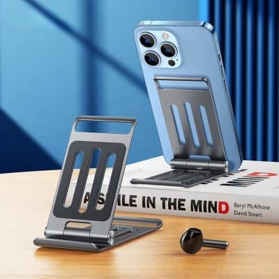 Wireless phone holder with foldable stand and magnetic clip for secure smartphone positioning. Compatible with various devices, stylish design, perfect for desk or on-the-go.