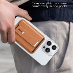 Slim tan leather cardholder attached to smartphone, holding cards, designed for convenience and portability.