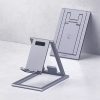 Sleek silver adjustable tablet stand with charging hole for iPad and tablets, modern design for workspace and home office.