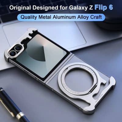 Aluminum metal alloy phone camera lens ring for Galaxy Z Flip 6, displayed on a sleek workspace with a laptop and pen.