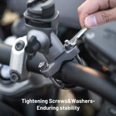 Bolt tightening process on motorcycle handlebar stem for bike maintenance and stability, close-up shot of wrench tightening screws and washers, emphasizing durable components and secure assembly for optimal riding performance.
