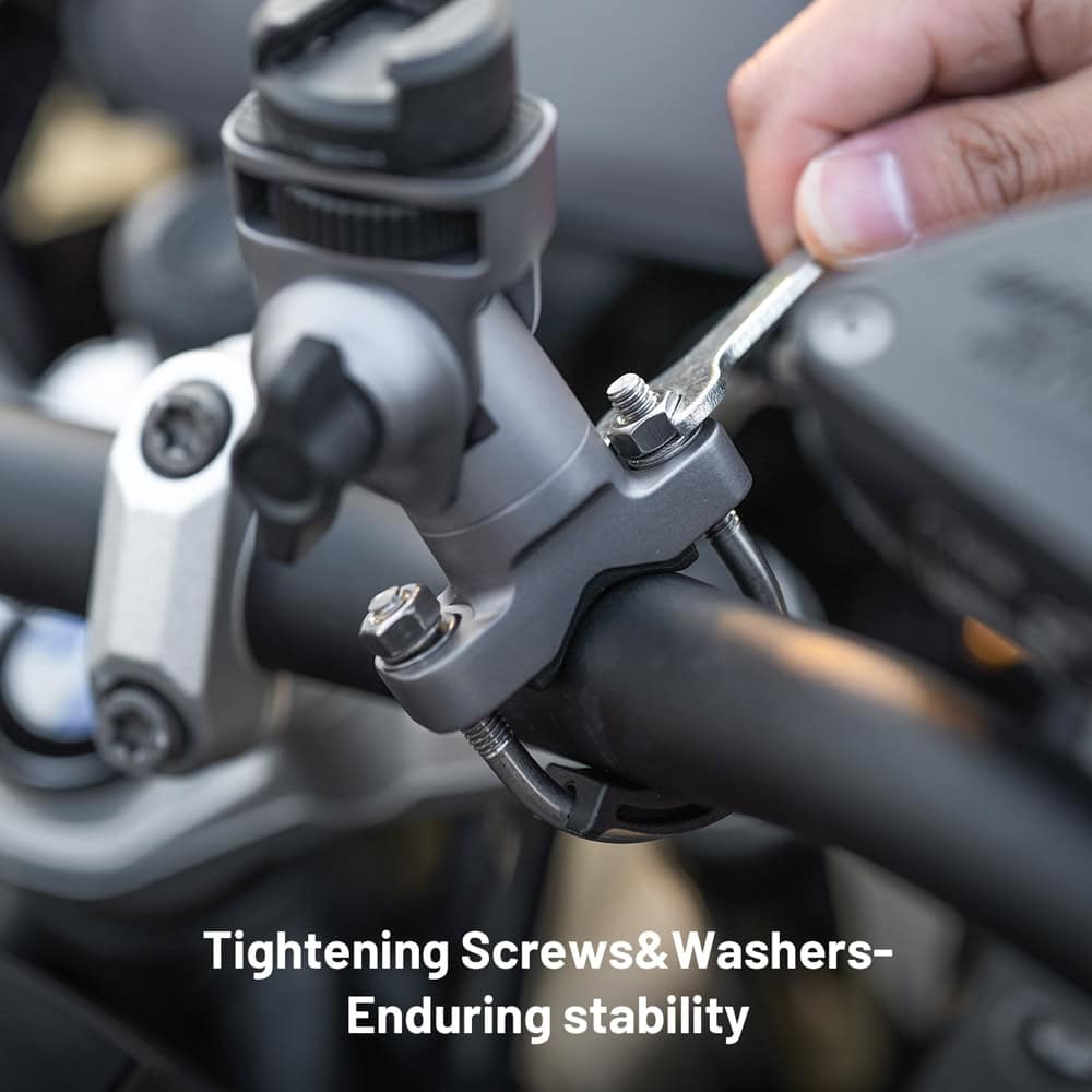 Bolt tightening process on motorcycle handlebar stem for bike maintenance and stability, close-up shot of wrench tightening screws and washers, emphasizing durable components and secure assembly for optimal riding performance.