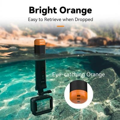 Bright orange waterproof safety whistle with black handle and compact design for outdoor activities and emergency situations.