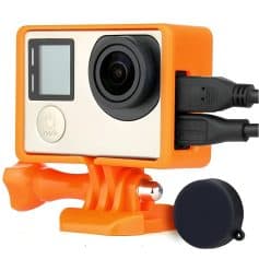 Portable action camera with waterproof housing, orange mount, and dual USB ports for outdoor sports and adventure filming. Perfect for high-quality, durable video recording.