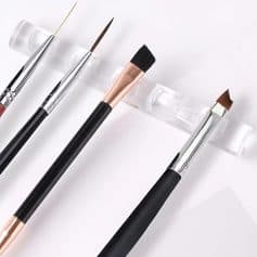 Precision makeup brushes displayed on a transparent stand, ideal for professional cosmetic application and beauty enhancement at Monalisa Store.