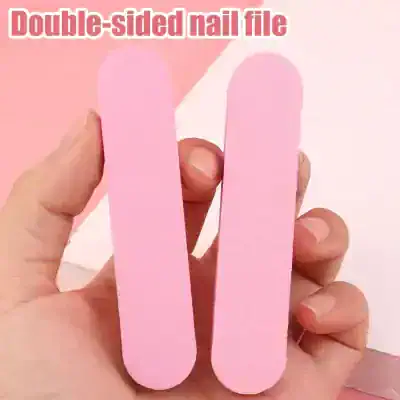 Pink double-sided nail file for manicure and pedicure, professional natural nail buffer, and grooming tool. Perfect for shaping, buffing, and smoothing nails with ease.