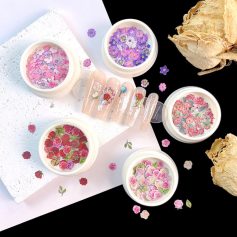 Flower nail art with dried petals, floral gel nails, and decorative powders for salon manicure, Monalisa Store.