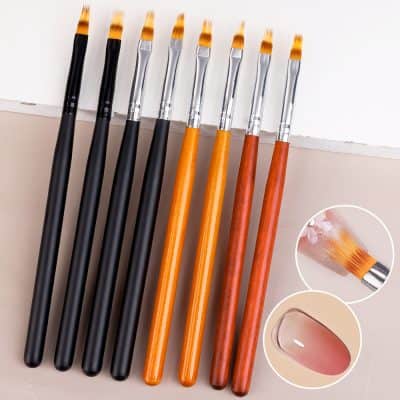 Smooth cosmetic brushes with wooden and black handles, ideal for makeup application and beauty routines.