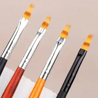 Fine art brushes with orange bristles and metallic ferrules for professional painting and art supplies at Monalisa Store.