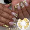 Elegant gold and white manicure with intricate nail art, 3D gold star embellishments, and decorative rhinestones showcasing advanced nail design techniques at Monalisa Store.