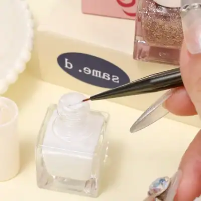 Fine nail glitter in pink and gold shades with nail art tools, ideal for professional or DIY manicure and pedicure nail art designs.