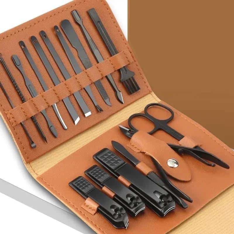 Precision manicure and pedicure tools set for professional and home use, includes nail clippers, scissors, cuticle pushers, and tweezers in a stylish leather case.