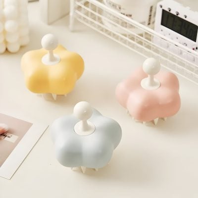 Colorful cloud-shaped storage containers with rounded white knobs, stylishly arranged on a white desk, ideal for organizing accessories or cosmetics in a modern Monalisa Store setting.