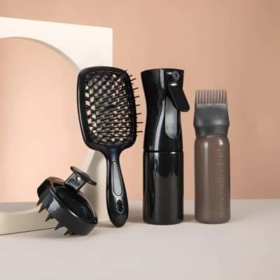 Electric hair styling tools including a hairbrush, spray bottle, and scalp massager, showcasing professional hair care and styling equipment at Monalisa Store.