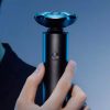 Electric shaver for men, close-up of modern electric razor on blue background, grooming and shaving, men's personal care, Monalisa Medical.