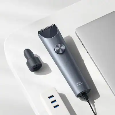 Electric hair trimmer with adjustable settings, USB charging port, and sleek design perfect for grooming routines. Compatible with USB power sources for convenient use.
