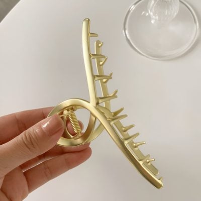 Gold hair claw clip for women, stylish everyday accessories for hair styling, high-quality hair grip from Monalisa Medical Store.