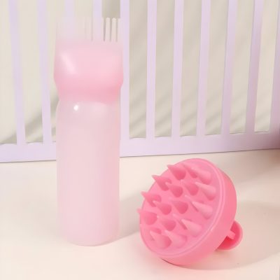 Pink silicone scalp massager and spray bottle, beauty and skincare tools for scalp health and hygiene, ideal for haircare routines, gentle on skin, stylish design.