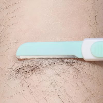 Close-up of a razor blade removing hair from skin, grooming, personal care, hair removal tool, hygienic shaving, smooth skin, hygiene product, Monalisa Medical Store.