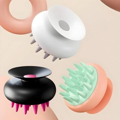 White and black massage and facial cleansing brushes with silicone bristles, designed for skincare at Monalisa Store, perfect for gentle cleansing and improving skin health.
