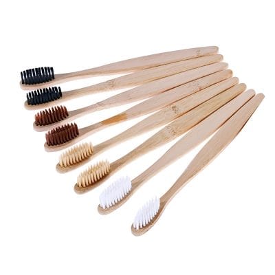 Biodegradable bamboo toothbrushes with black, brown, beige, and white bristles, eco-friendly oral care tools, perfect for sustainable oral hygiene routines.